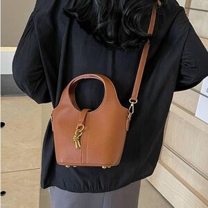 Top handle leather bucket bag with crossbody strap small size in honey brown